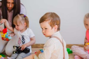 Toddler exploring daycare activities 