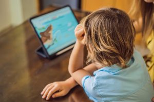 Child playing with educational toys away from screens
