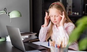 Child playing with educational toys away from screens
