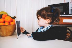 Child playing with educational toys away from screens
